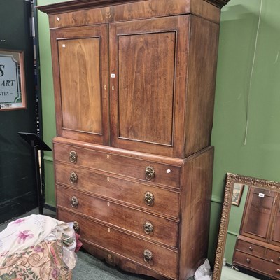 Lot 359 - An early 19th-century mahogany linen press...