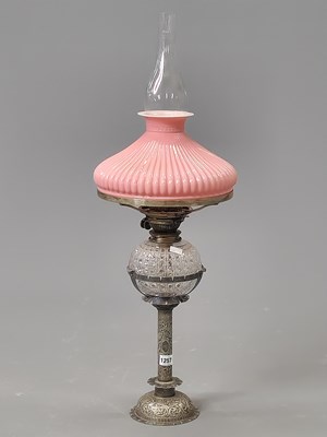 Lot 1257 - A late Victorian oil lamp with silver-plated...