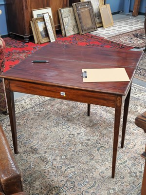 Lot 1268 - A George III mahogany foldover tea table with...