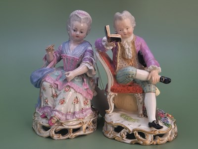 Lot 1312 - Two early 20th century Meissen seated figures,...