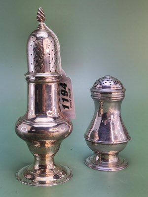 Lot 1194 - A silver baluster-shaped pepperette and a...