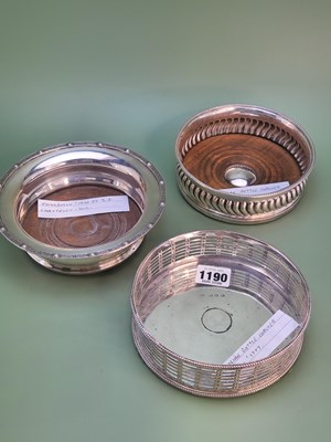 Lot 1190 - A George III silver bottle coaster with...