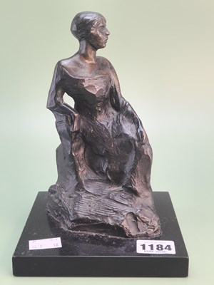 Lot 1184 - A Victorian bronze figure of a seated lady on...