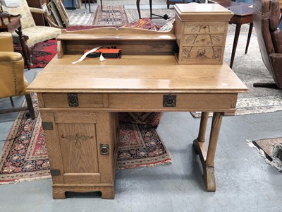 Lot 1331 - An antique Swedish Arts and Crafts style oak...