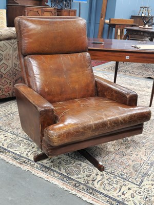Lot 1332 - A mid-century high-back leather swivel...