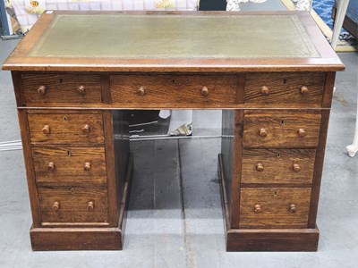 Lot 1335 - An oak twin pedestal desk H 74 W 106 D 60cm