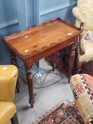 Lot 1352 - A Victorian mahogany galleried table on turned...