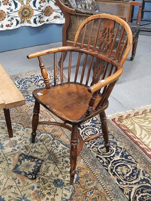 Lot 1340 - An antique yew and elm Windsor armchair with...