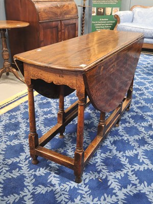 Lot 1341 - A 19th century oak gateleg table, ovel top on...