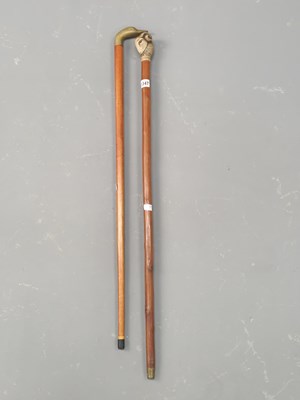 Lot 1347 - Two walking canes with figural duck and sheep...