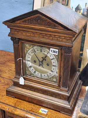 Lot 1362 - An early 20th century oak cased mantel clock,...