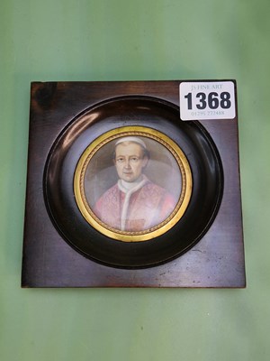 Lot 1368 - A wooden framed round portrait miniature of...