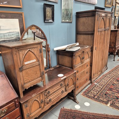 Lot 74 - A vintage oak bedroom suite with gothic arch...