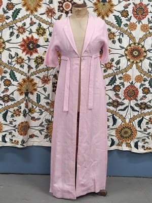 Lot 62 - Clothing - A long baby pink overcoat for a...