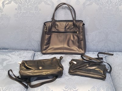 Lot 91 - Handbags - A large navy leather handbag by...