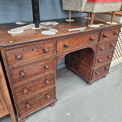 Lot 7 - A 19th century mahogany kneehole desk , the...
