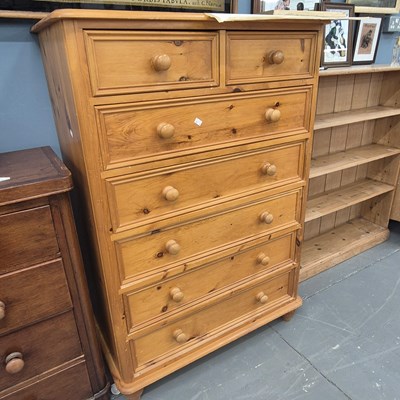 Lot 28 - A vintage pine chest of two over five drawers...