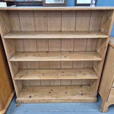 Lot 30 - A pine bookshelf of four shelves H 122 W 114 D...
