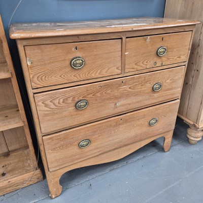 Lot 32 - A small 19th century pine chest of two over...