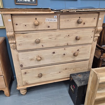 Lot 34 - A large antique pine chest of two over three...