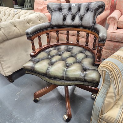 Lot 42 - A modern button back swivel office chair