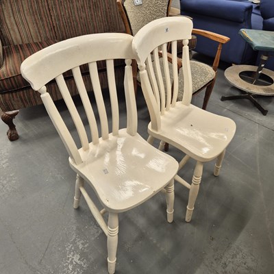 Lot 57 - A pair of painted slat back kitchen chairs on...