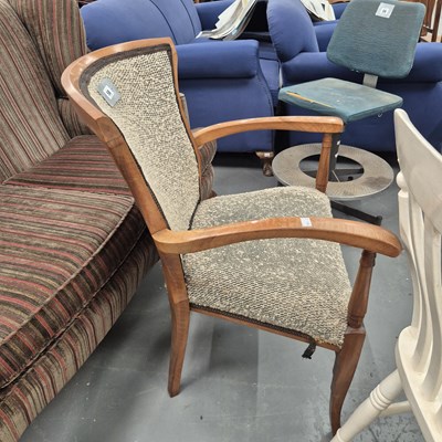 Lot 58 - An Art Deco style walnut elbow chair in a...