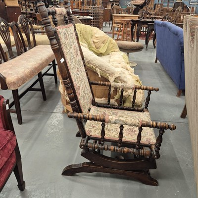 Lot 60 - An American style rocking chair with turned...