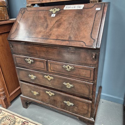 Lot 70 - A small 19th century walnut bureau of two over...