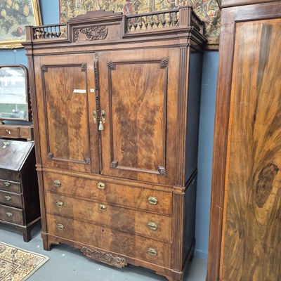 Lot 72 - An early 19th century flame mahogany linen...