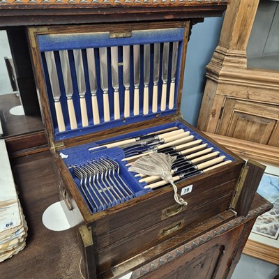 Lot 79 - An oak canteen of twelve settings of dining...
