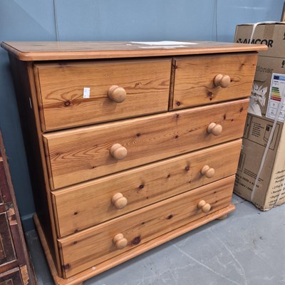 Lot 92 - A small modern pine chest of two over three...